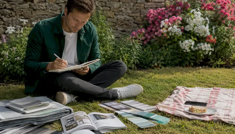 Man writing notes on renovation choices