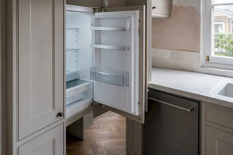 Fridge door blocked by kitchen cabinet