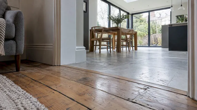 Floor and trim transition between old and new rooms